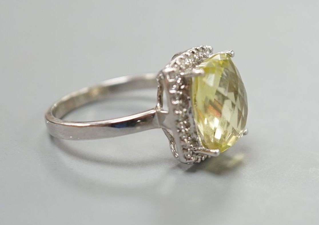 A modern 18ct white gold, fancy cut citrine and diamond cluster set dress ring, size M, gross weight 4.3 grams.